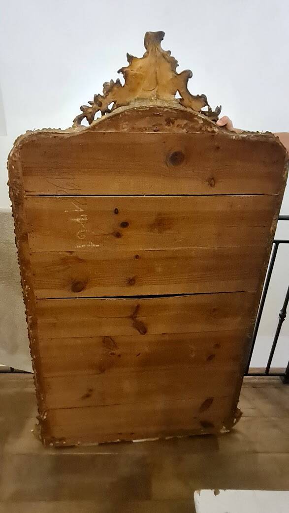 Antique Louis Philippe mirror with a pediment.