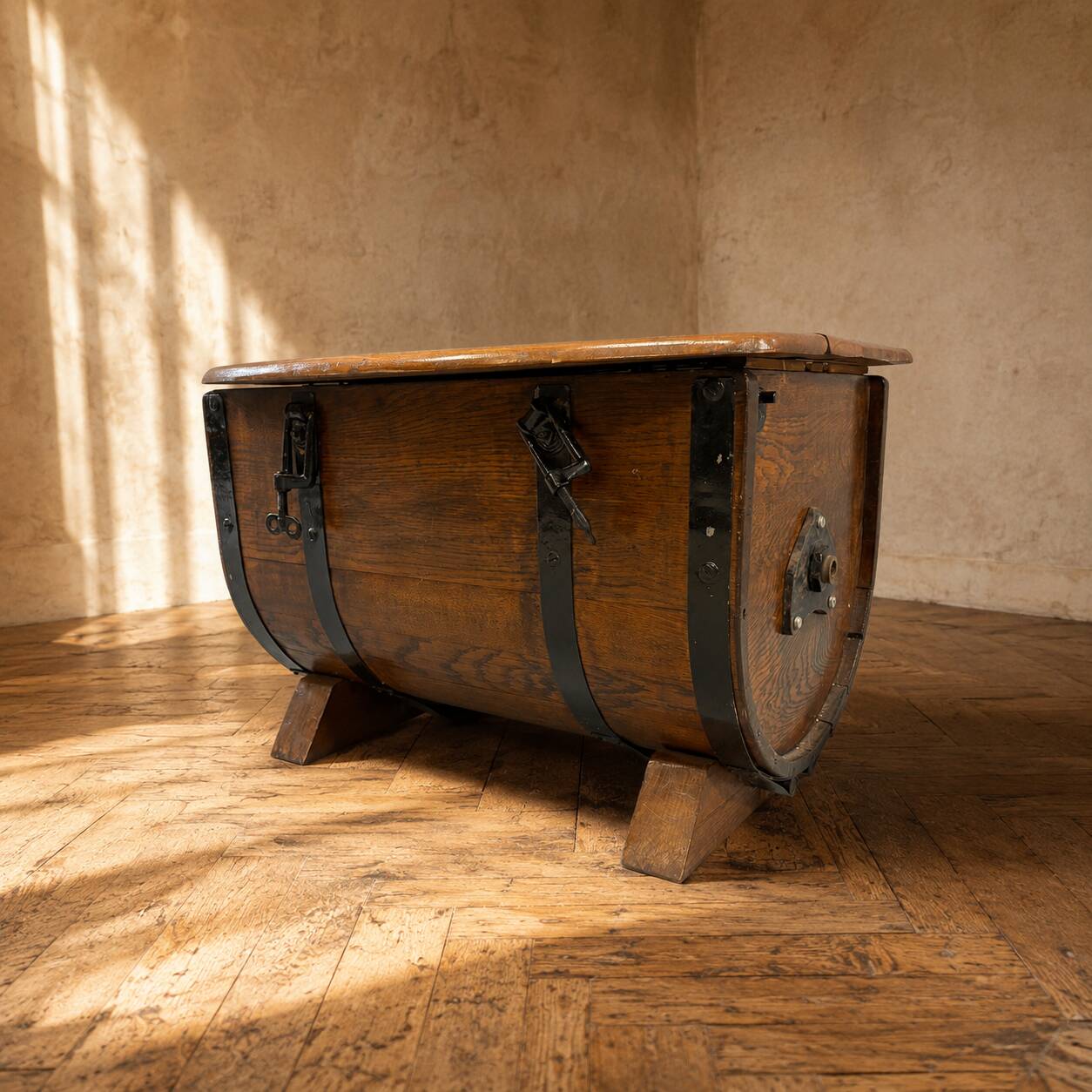 Oak barrel-shaped storage chest with black metal straps, 1930s-1940s.