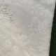 12 damask linen table napkins with an antique silk monogram from the 19th century.