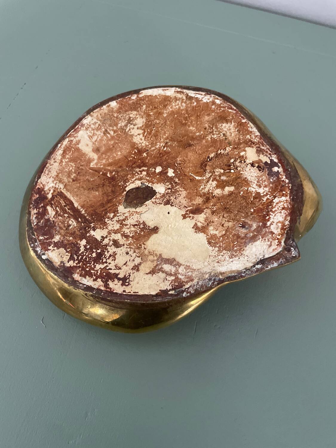 Cat-shaped catchall that looks like it's sleeping.