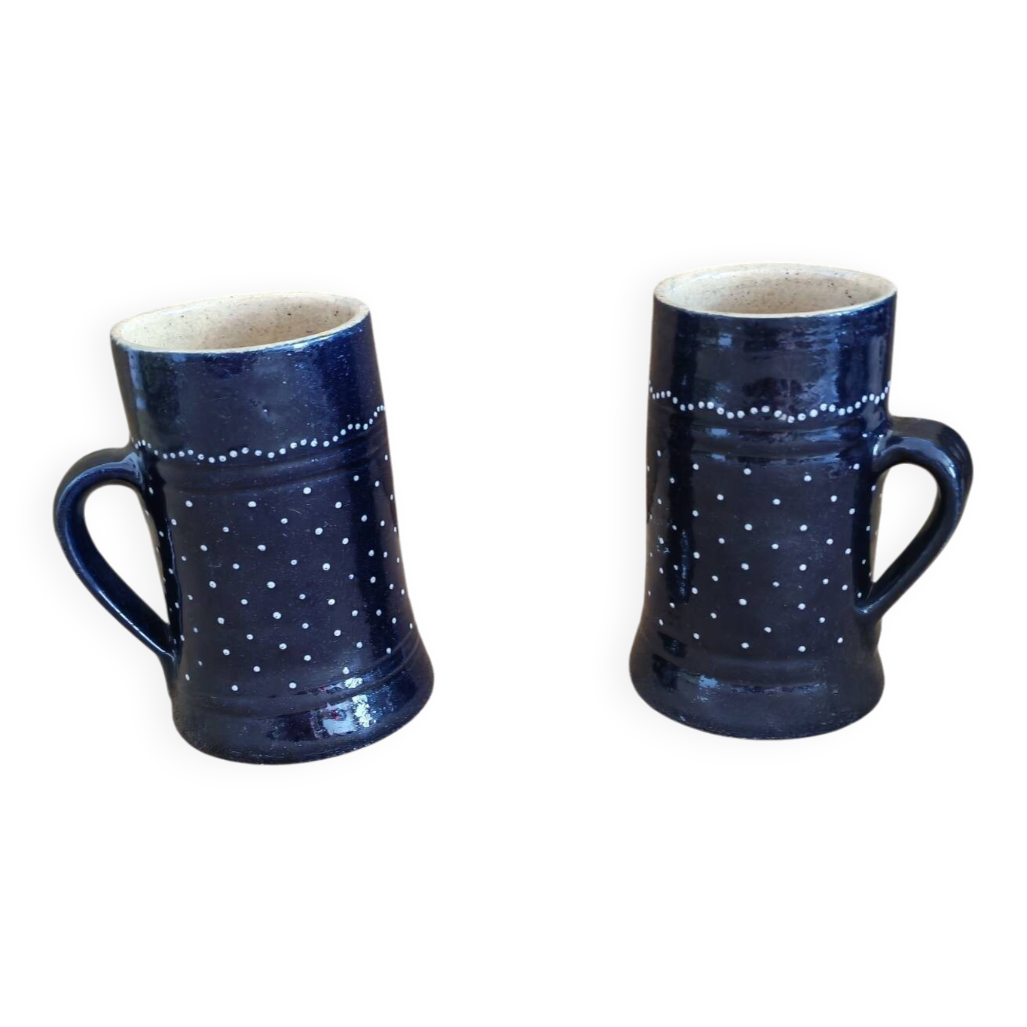 Two vintage mugs in traditional German earthenware.