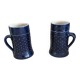 Two vintage mugs in traditional German earthenware.