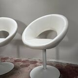 Pair of vintage white swivel armchairs in tulip style.