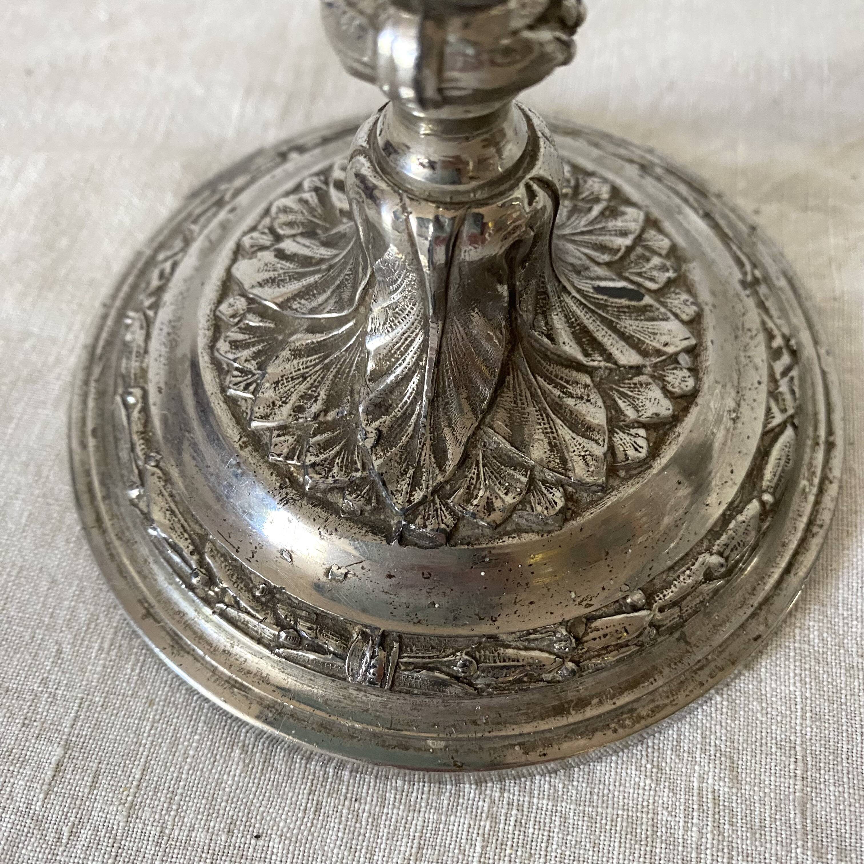 Pair of old silver-plated candlesticks