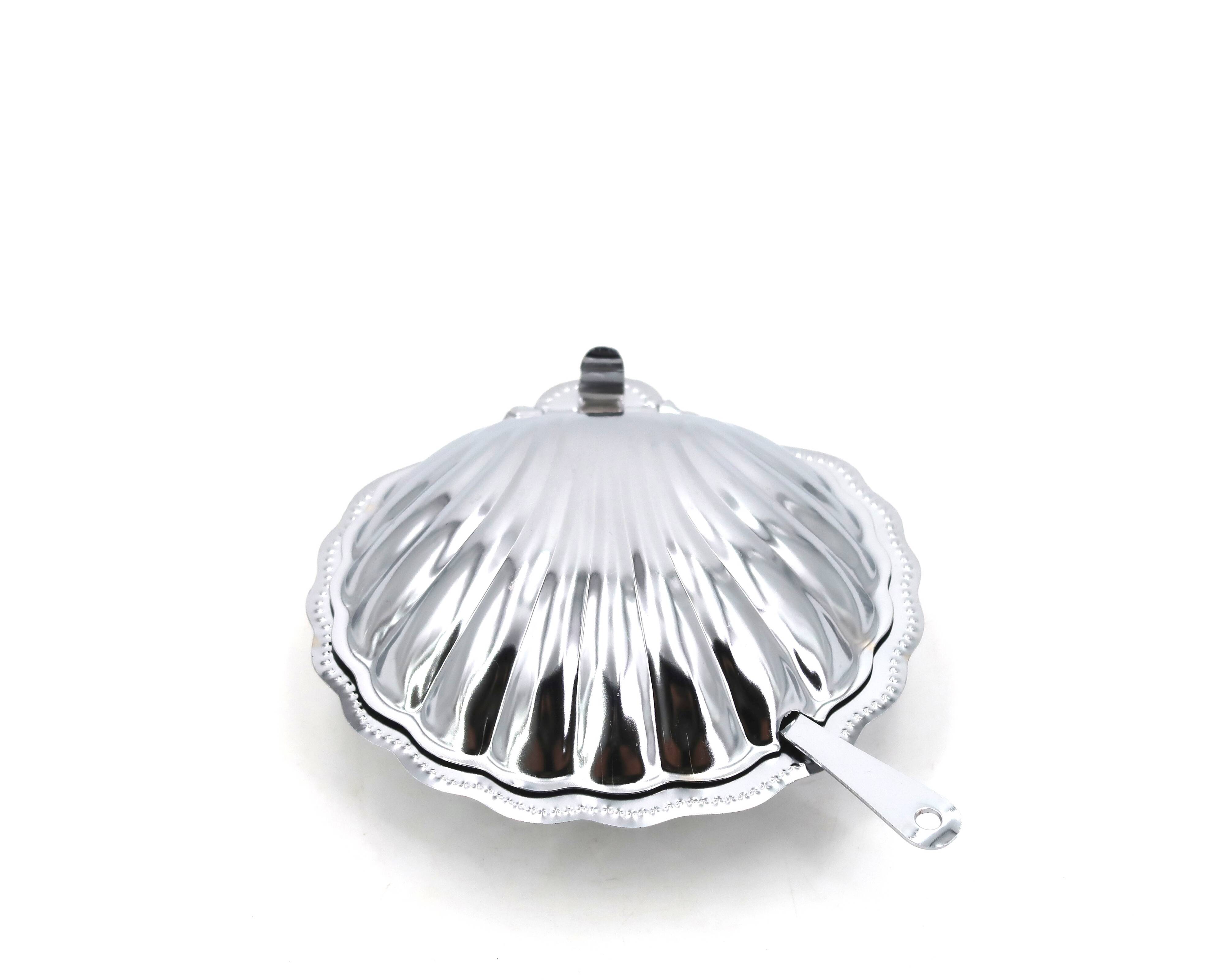 Silver-plated metal and glass shell-shaped butter dish with its knife.