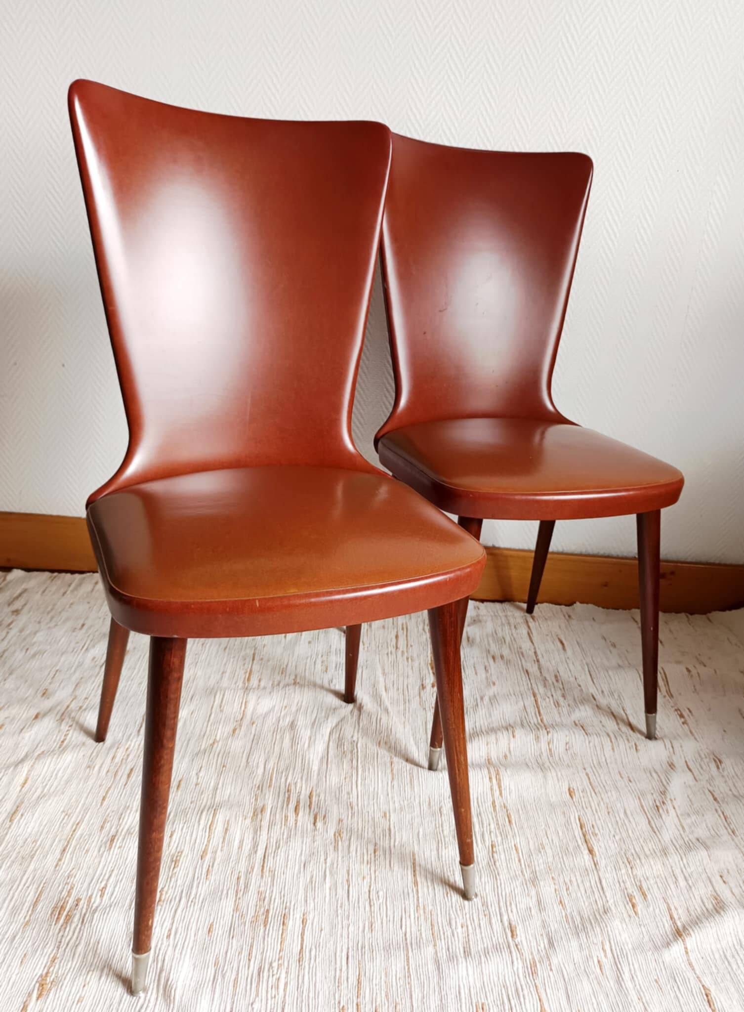 Pair of vintage vinyl chairs with splayed legs