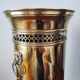 Vintage brass umbrella stand with lion decoration.
