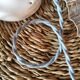 Vintage suspension in white lace opaline, sky blue cable.