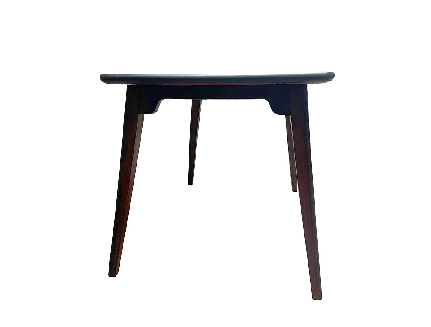 Small Danish side table/coffee table in patinated mahogany.