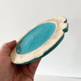 Ceramic trivet and bottle coaster from the 1950s.