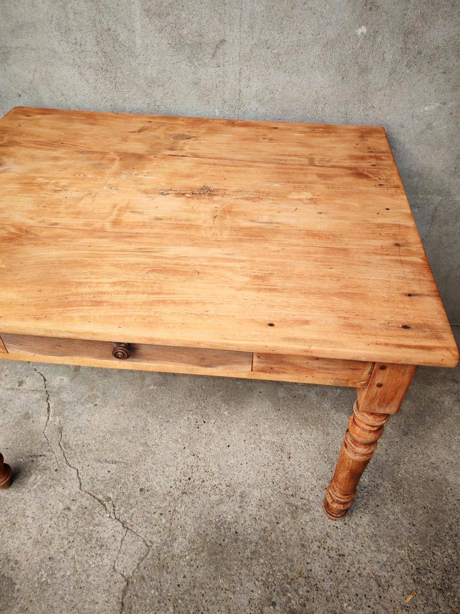 Small farmhouse table in light wood and tiled floors
