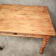 Small farmhouse table in light wood and tiled floors