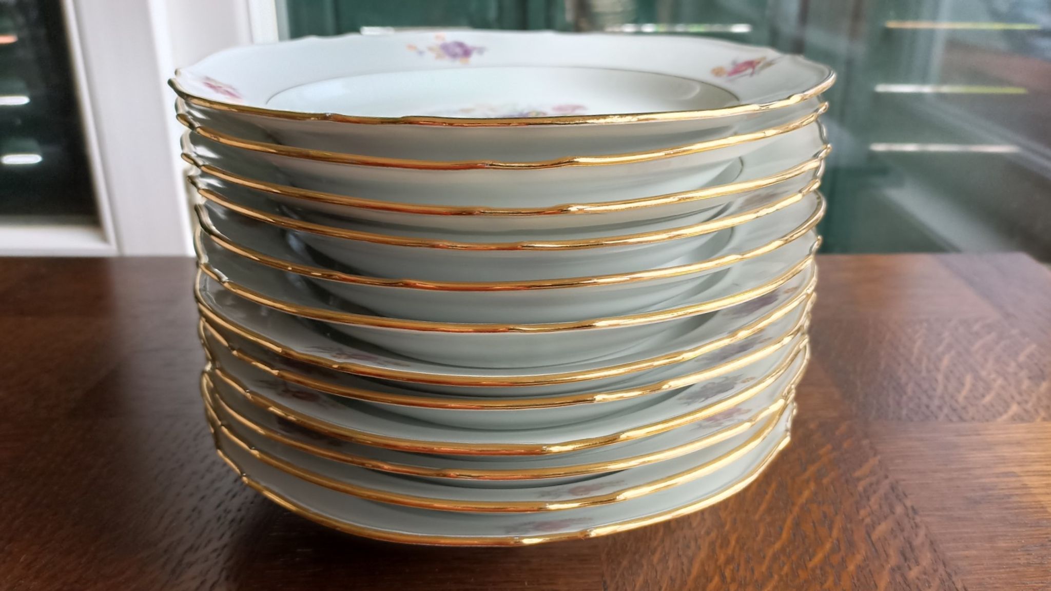 12 semi-hollow plates in Vierzon porcelain decorated with flowers and gilding