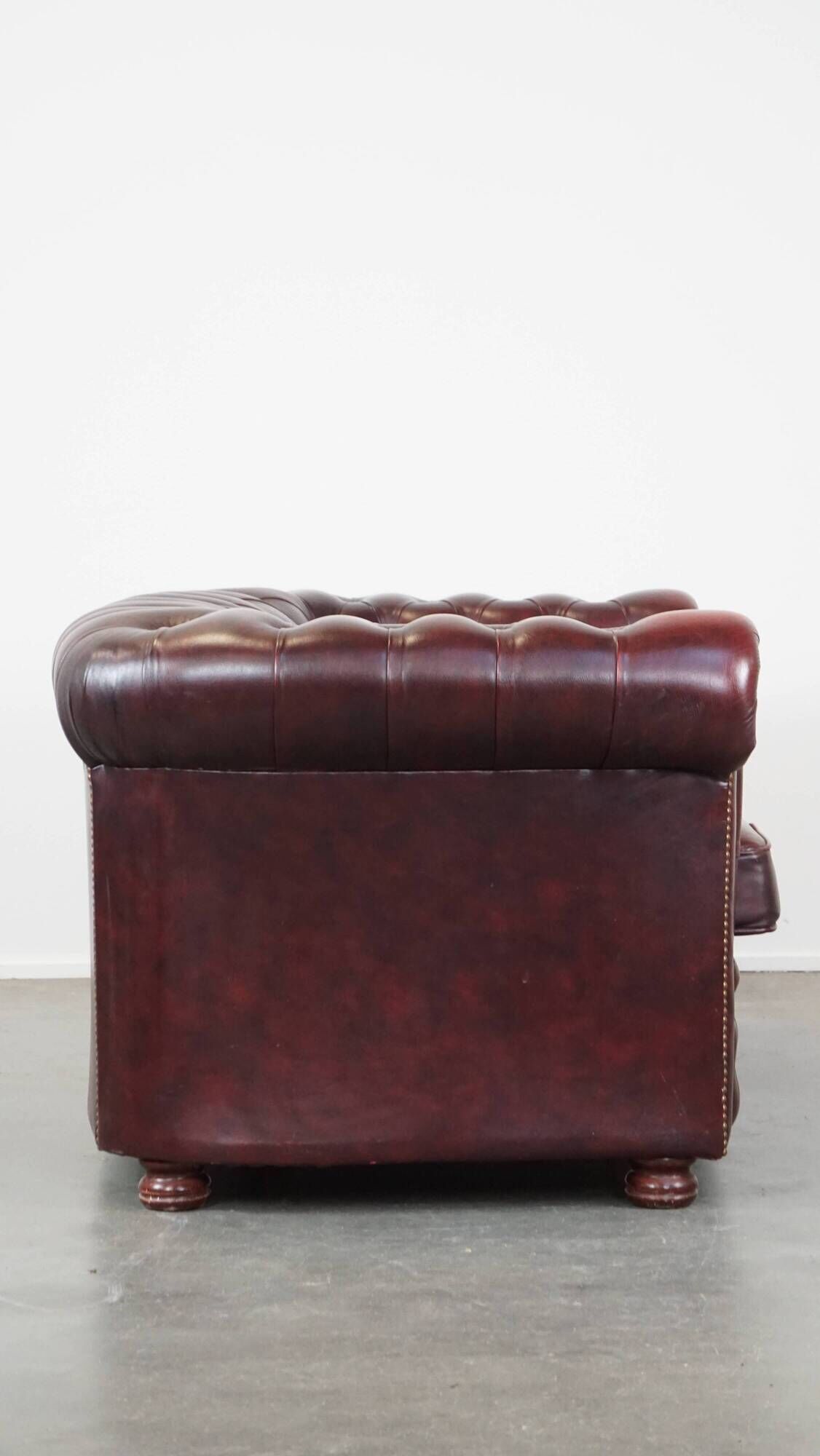 Original English Chesterfield sofa in red cowhide 2 seater