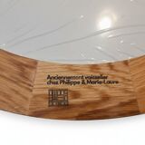 Round wall mirror made of solid wood