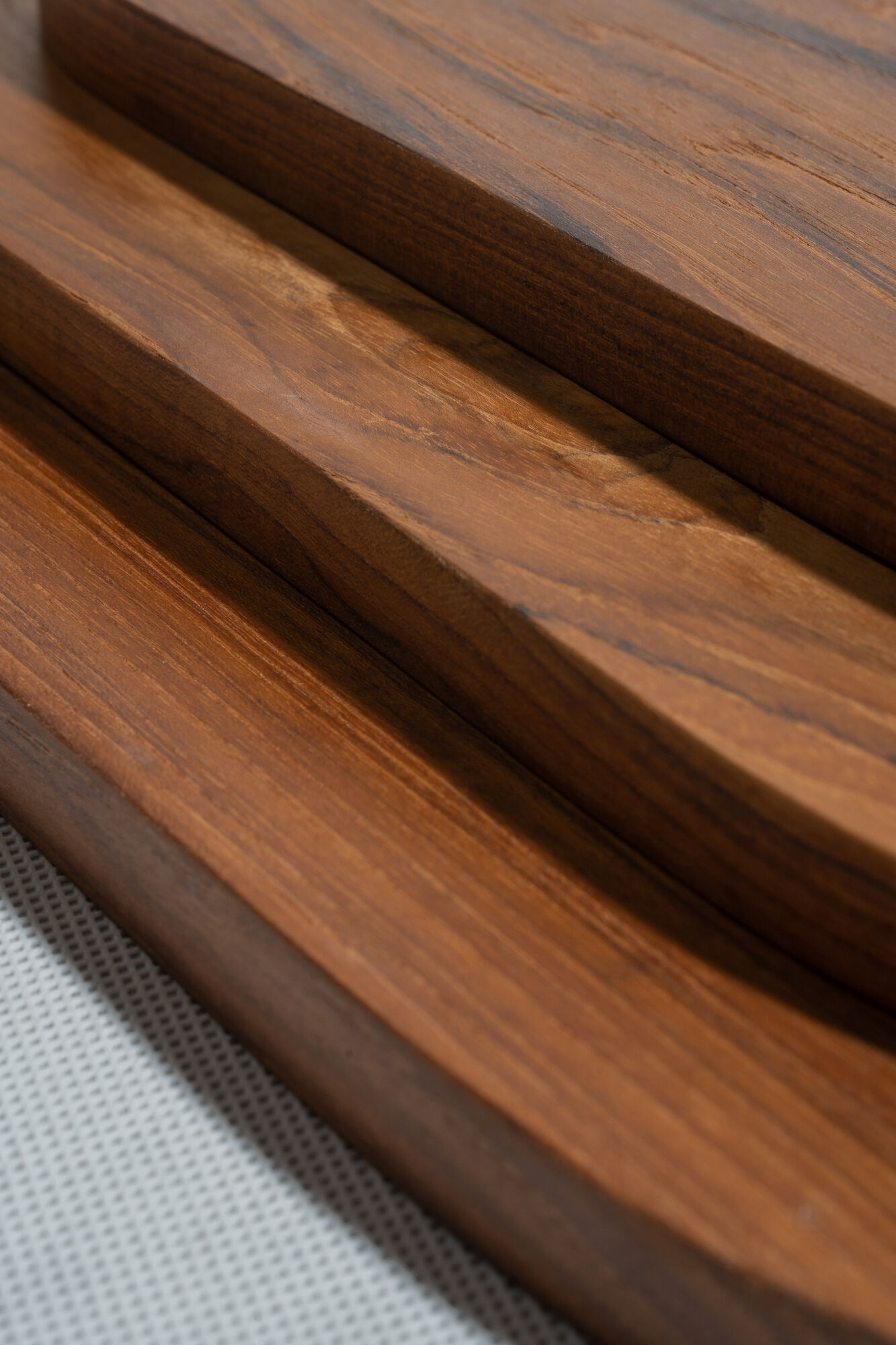 Trio of oval teak trays or cups