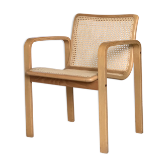 Vintage armchair in caning