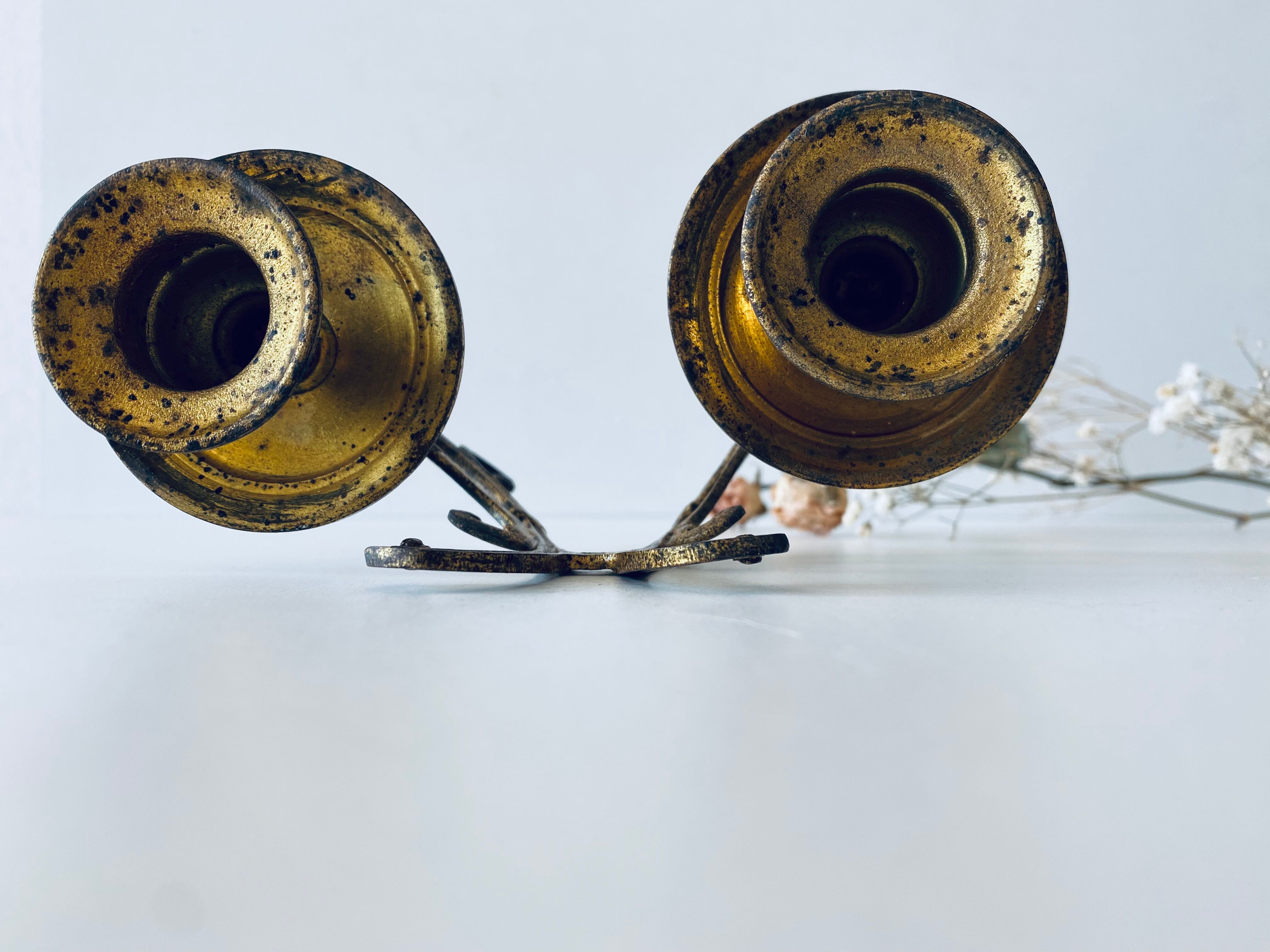 Old wall candle holder in golden brass
