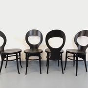 Set of 4 vintage Mouette chairs by Baumann in black wood from the 1960s.