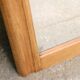 Art Deco fireplace mirror in light oak. Mercury glass.