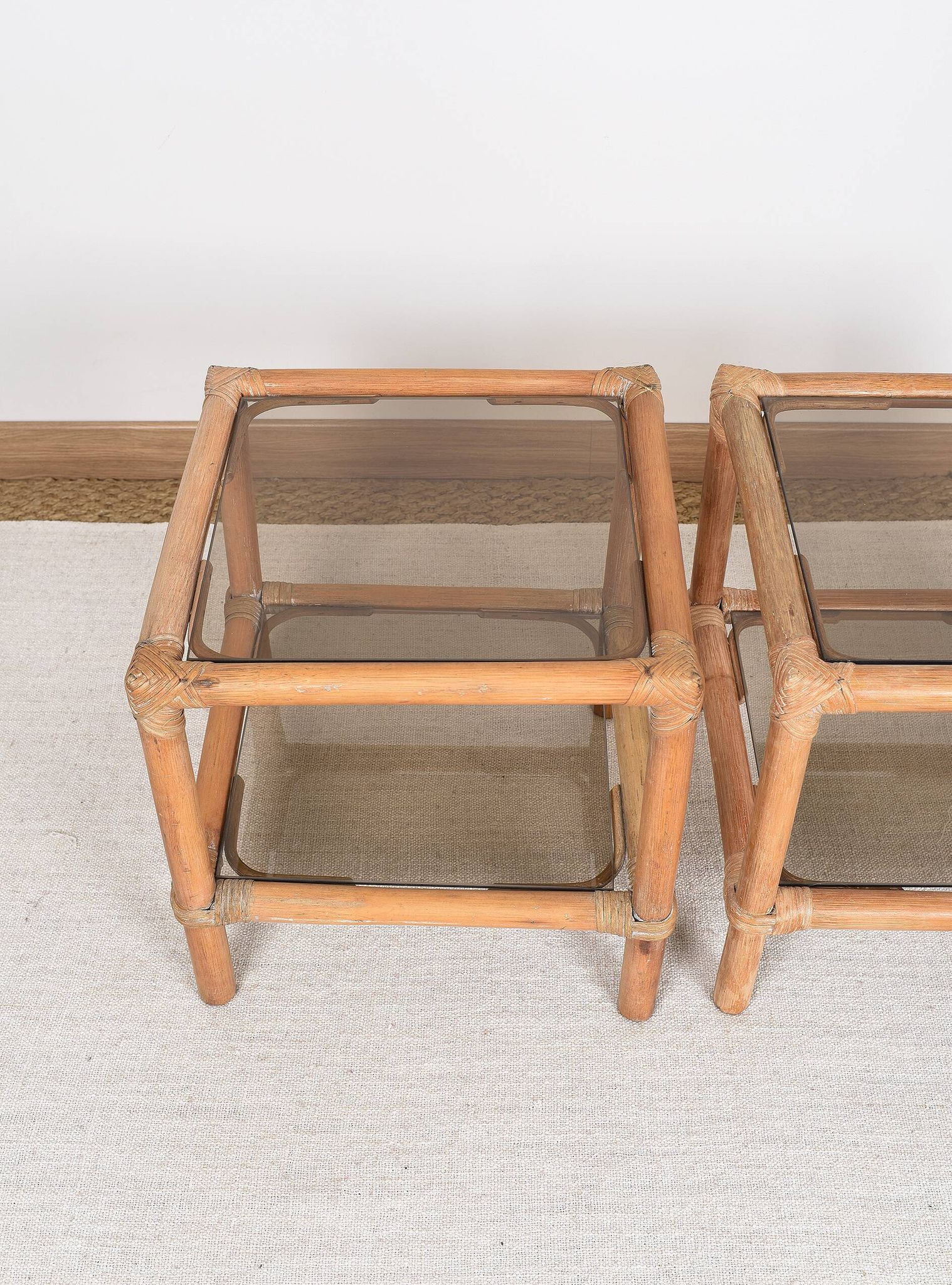 Pair of bedside tables or side tables, in rattan and smoked glass