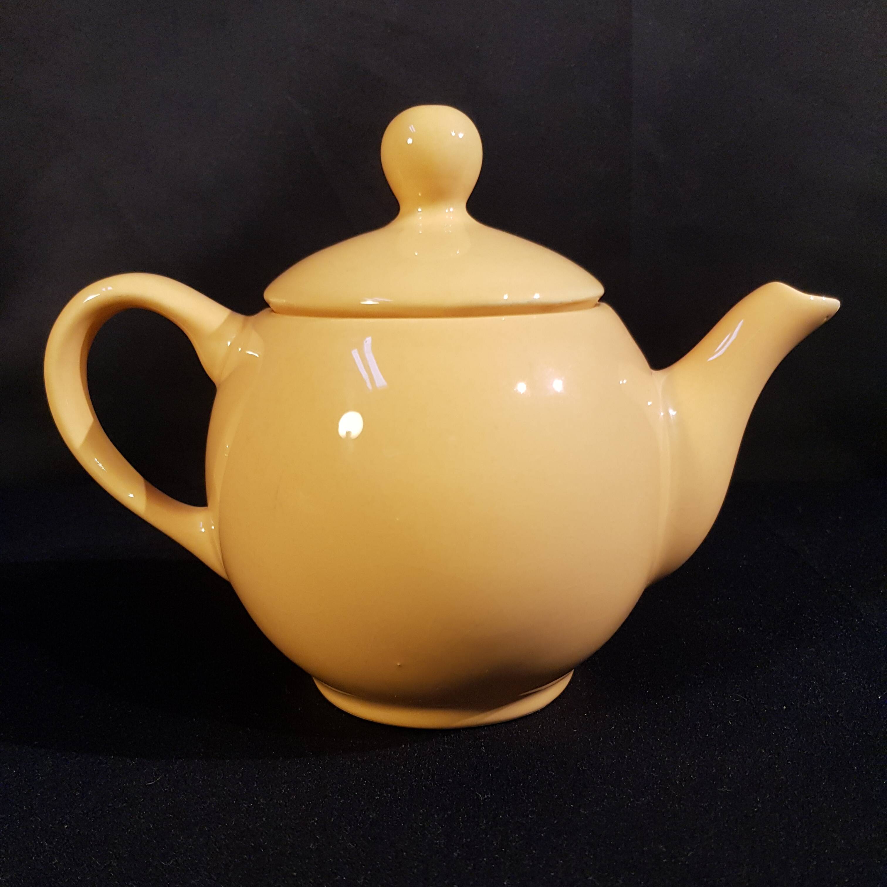 Yellow ceramic teapot