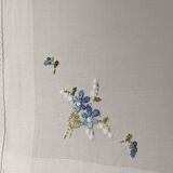 Square of hand-embroidered fabric forget-me-not