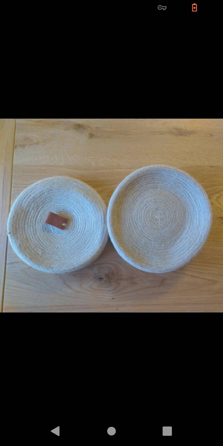 Basket with braided rope and leather lid