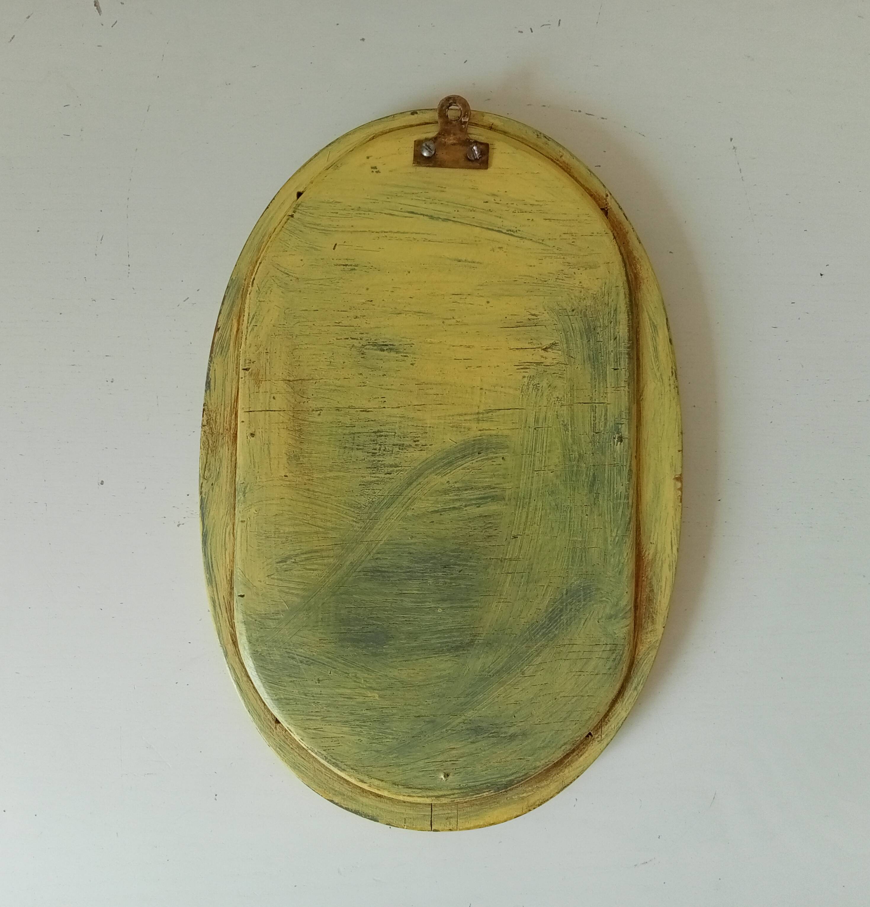 Small antique oval mirror