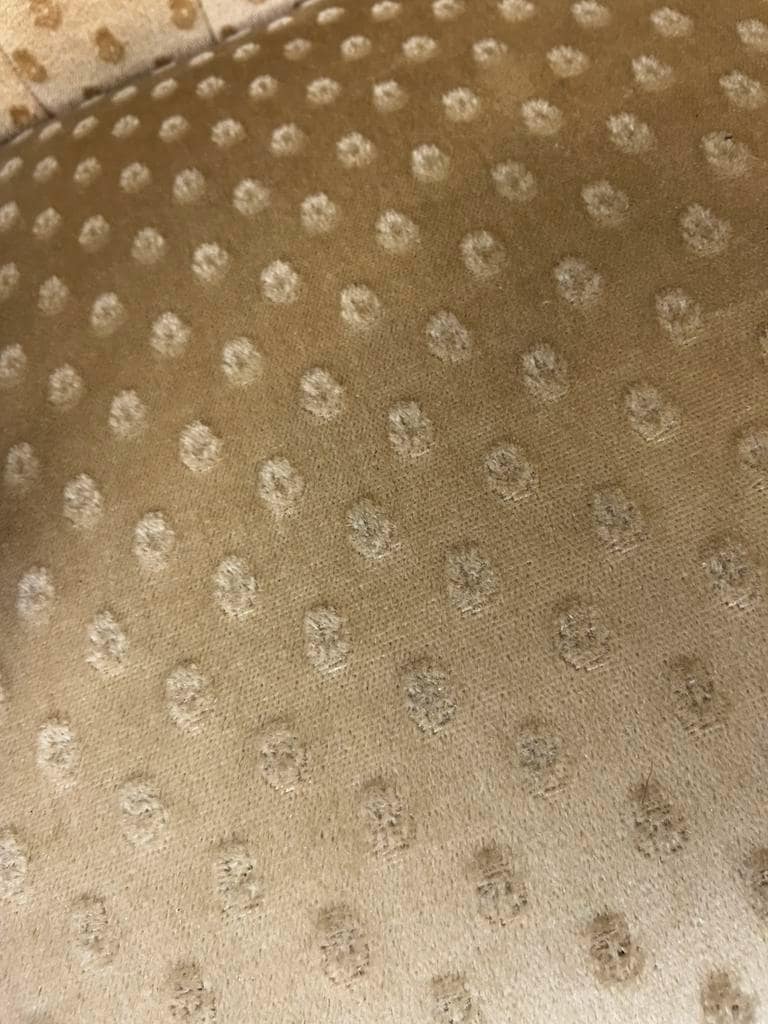 Vintage wooden armchair with rattan weaving.