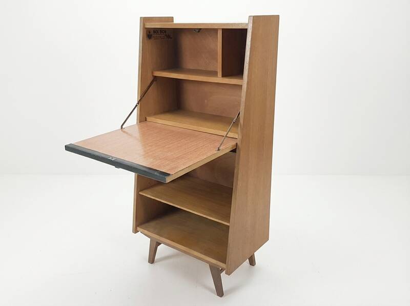 Vintage 1960s secretary desk with an angled design, light wood, and tapered legs.