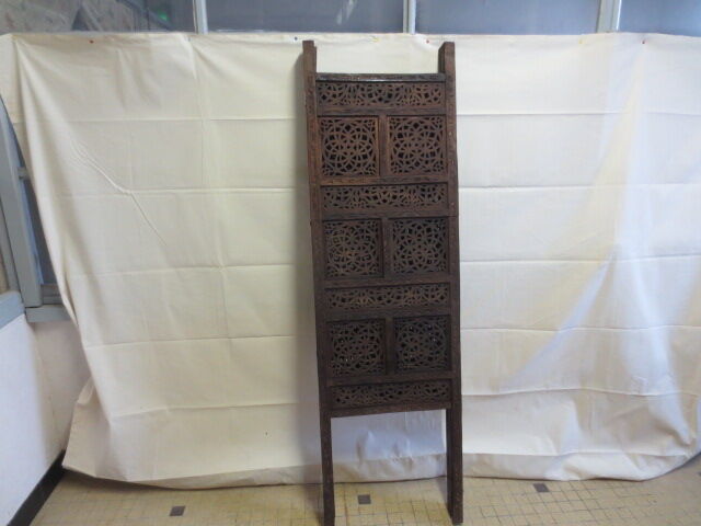 Former screen in treated exotic wood