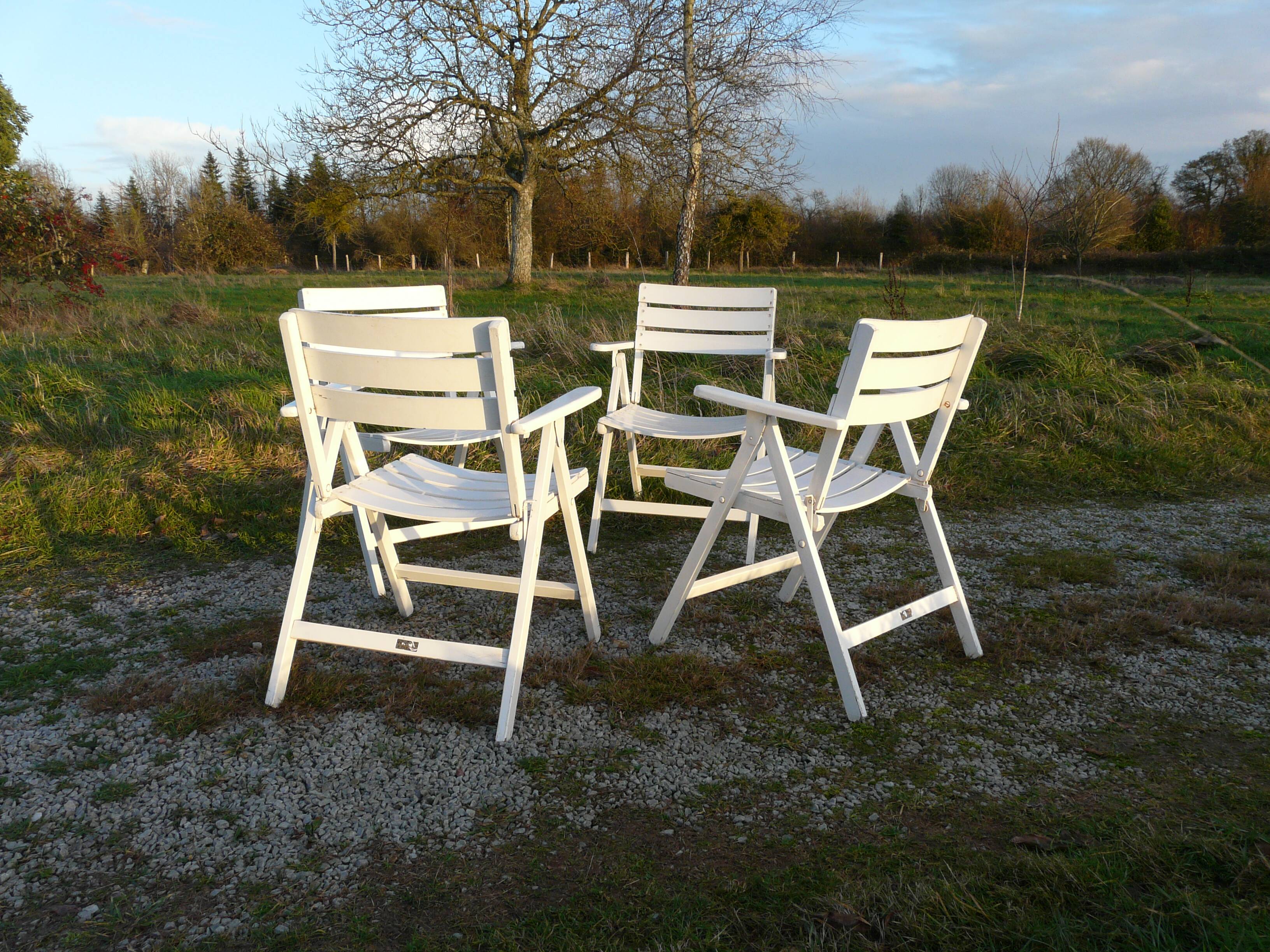 Four vintage wooden garden armchairs from the 1950s