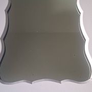 Mid-20th century rectangular wall mirror with a powder pink frame.
