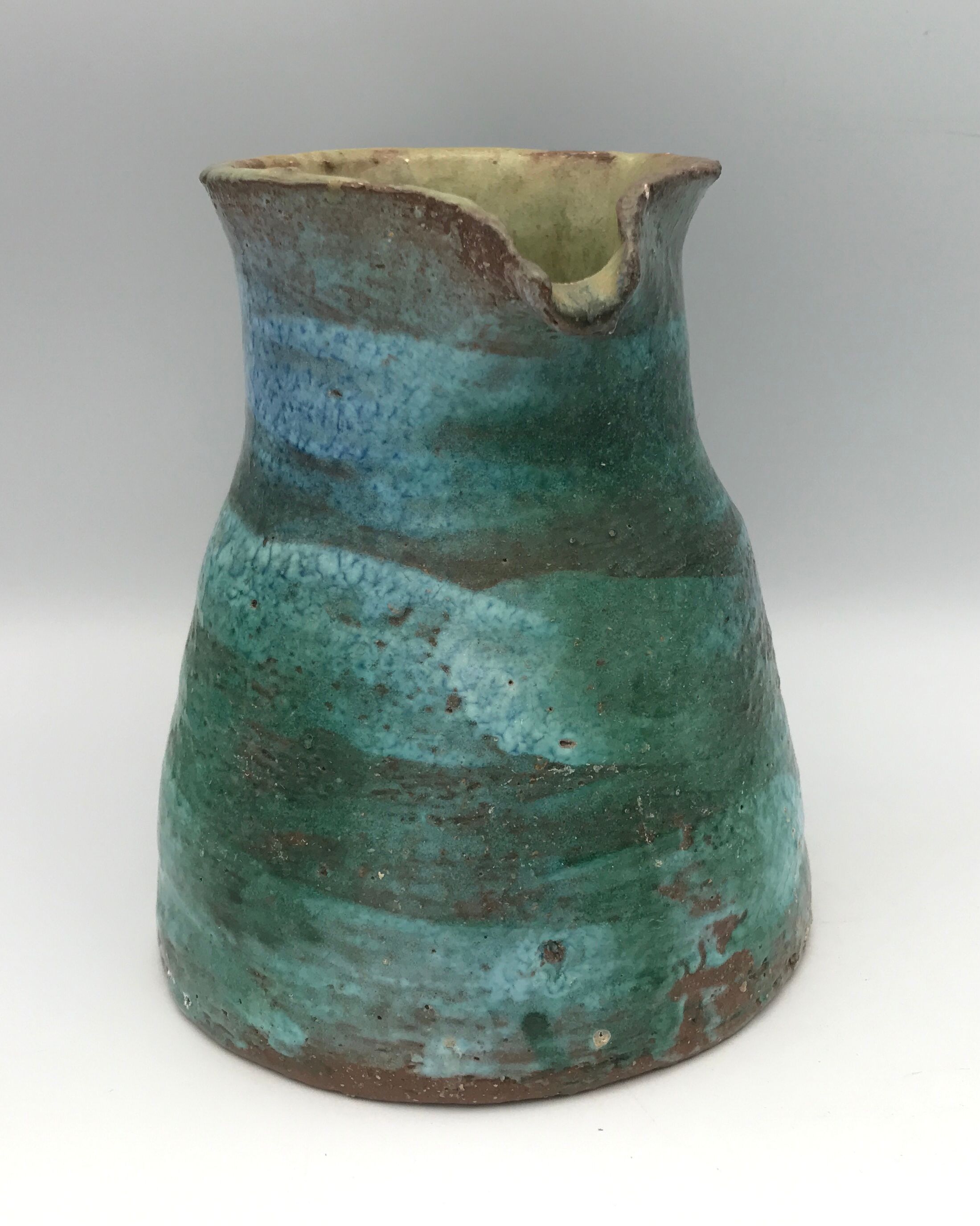 Vintage broc pitcher in enamelled sandstone with effect of blue shades, turquoise green signed