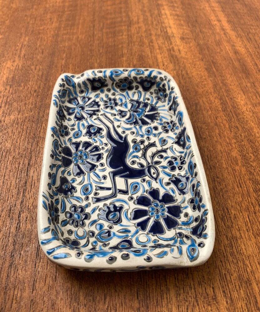 Vintage handmade blue ceramic ashtray with deer and flower ornament from Rodos Ceramics.