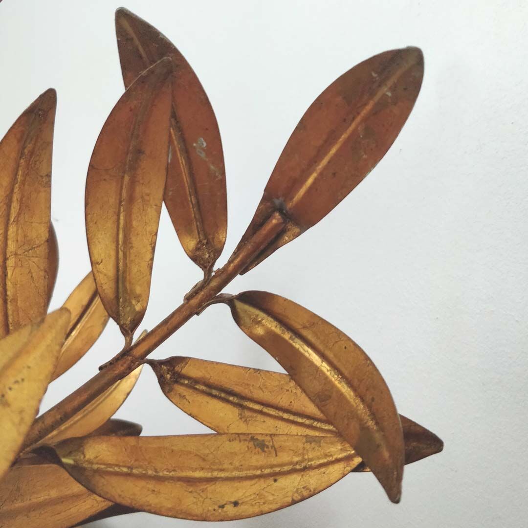 Golden metal chandelier palm leaves