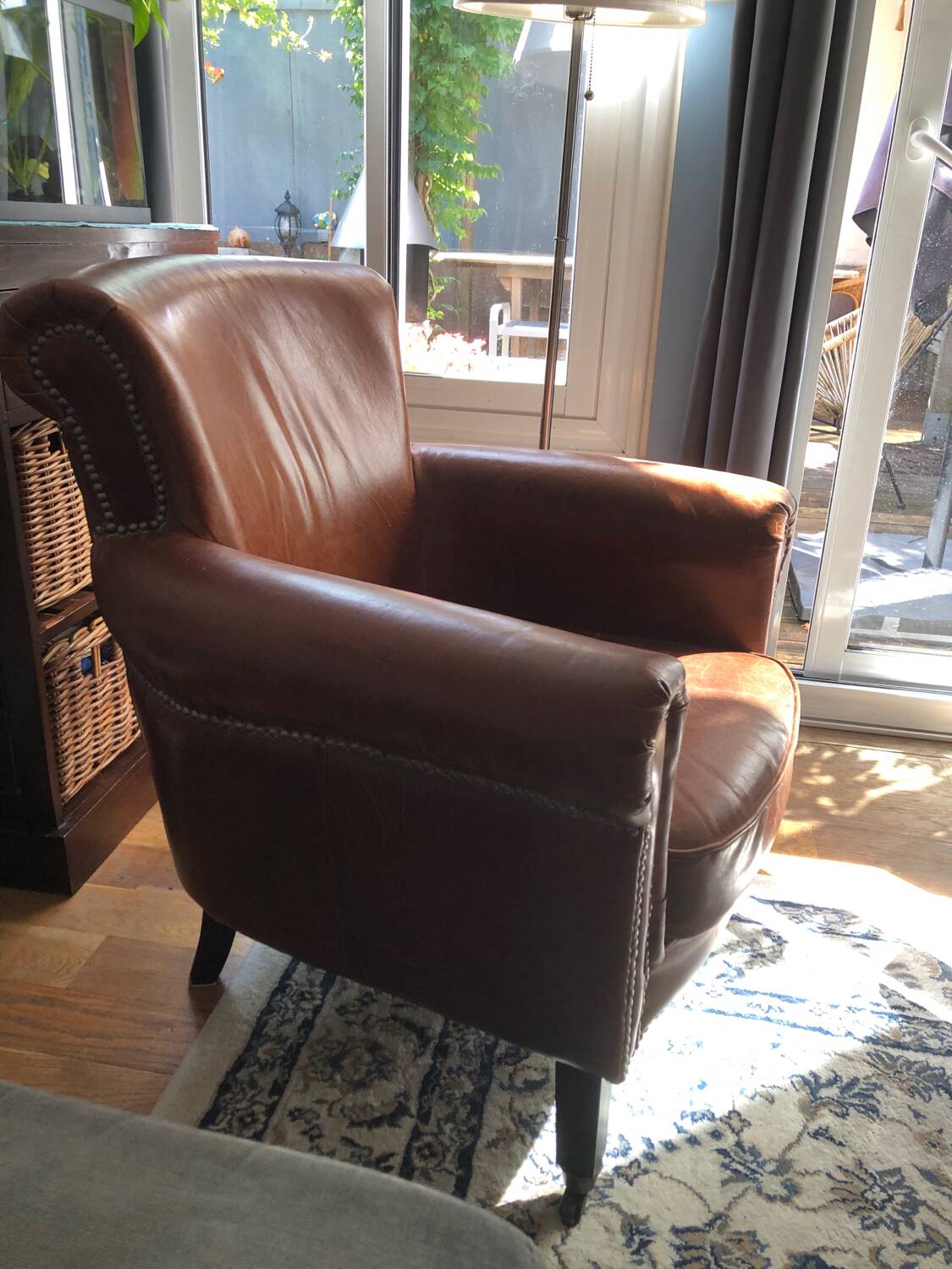 Industrial style aged leather armchair