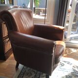 Industrial style aged leather armchair