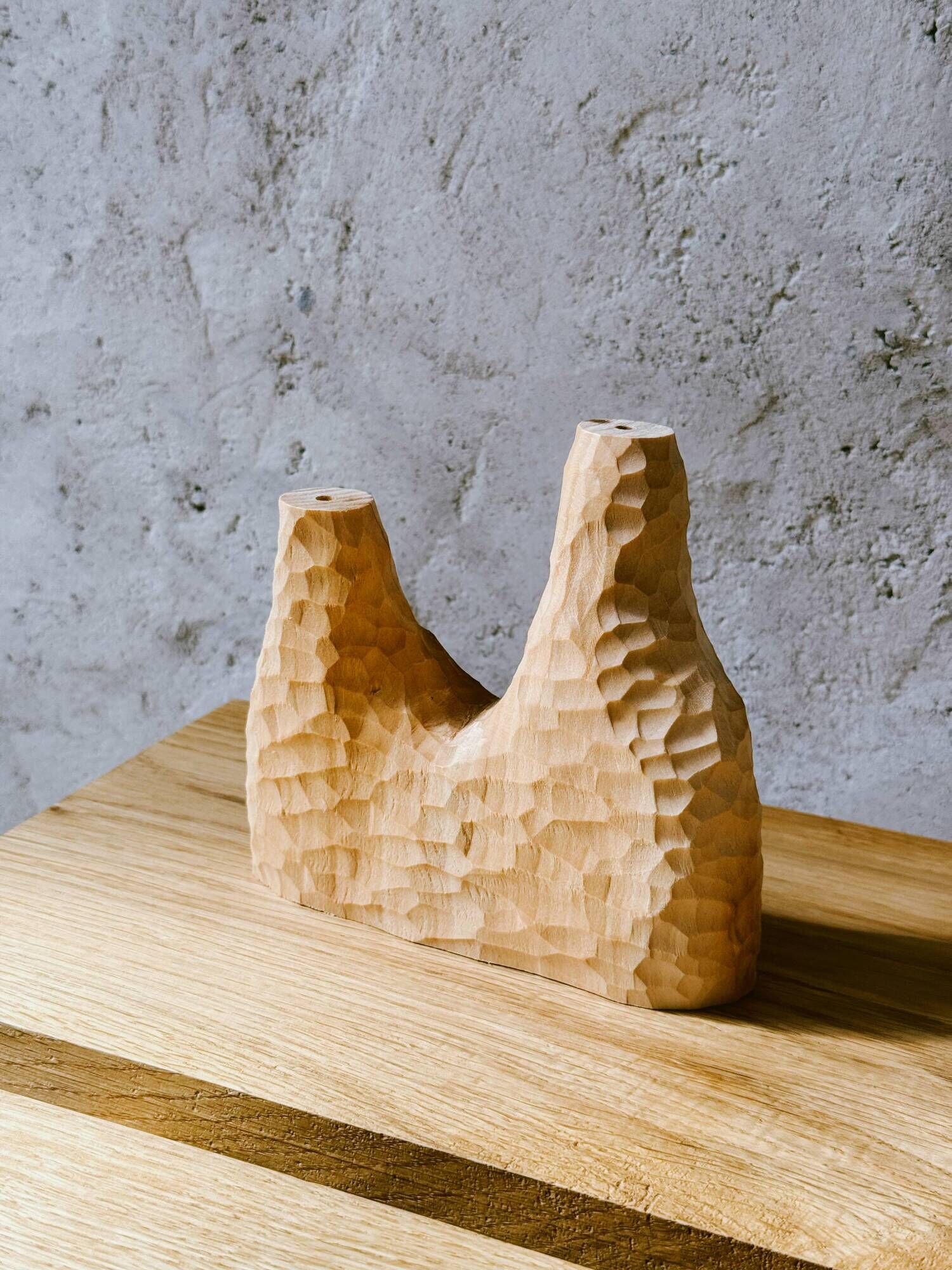 Hand-carved soliflore vase in solid lime wood.