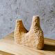 Hand-carved soliflore vase in solid lime wood.