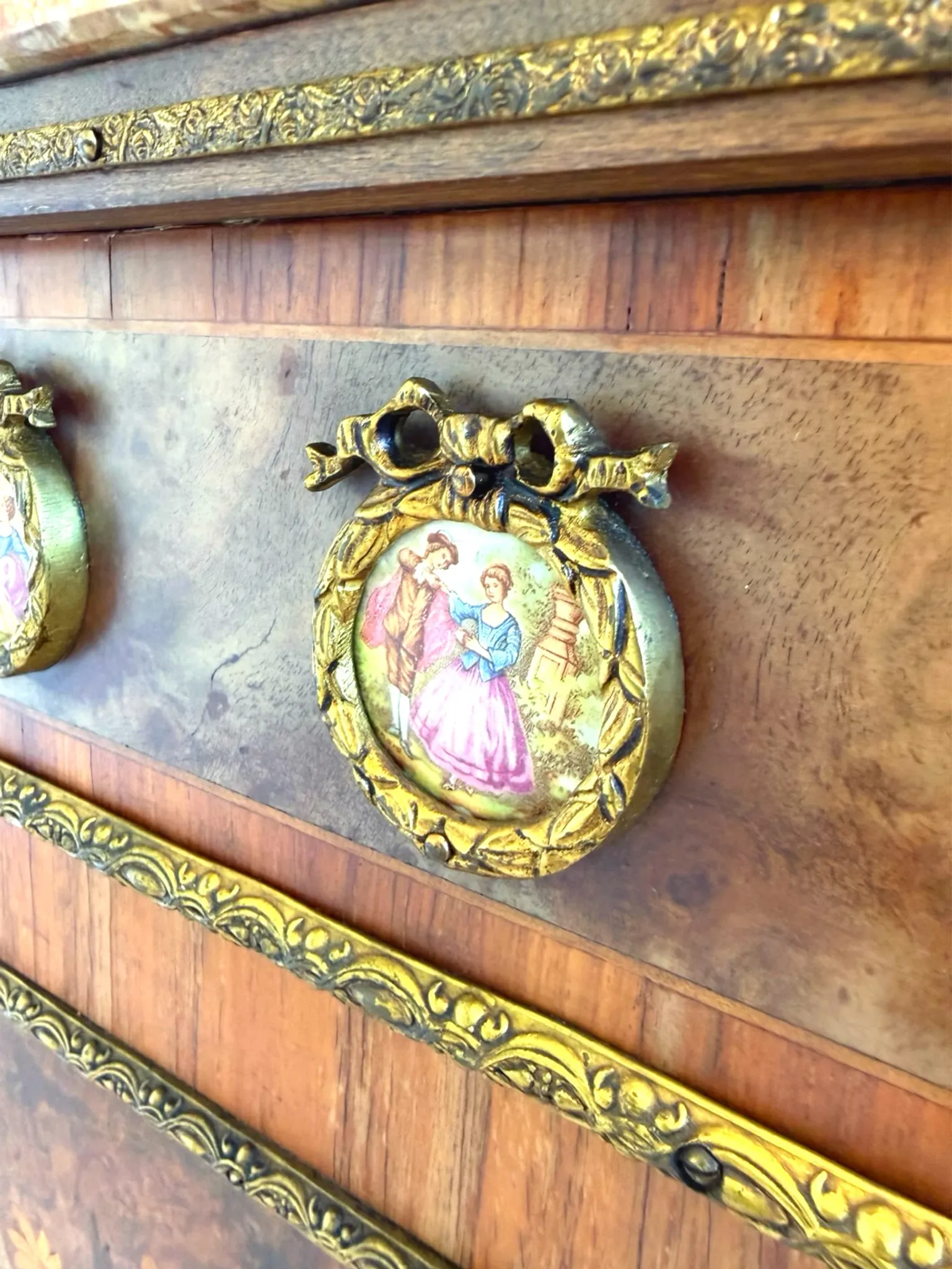 An antique French Louis XVI-style marble-top side cabinet