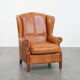 Fauteuil à oreilles en cuir de vache