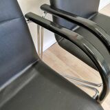 Set of 2 vintage office chairs in black leather chrome base plastic armrests / retro 1980s room
