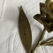 Flower candlestick and removable ashtrays in solid brass.