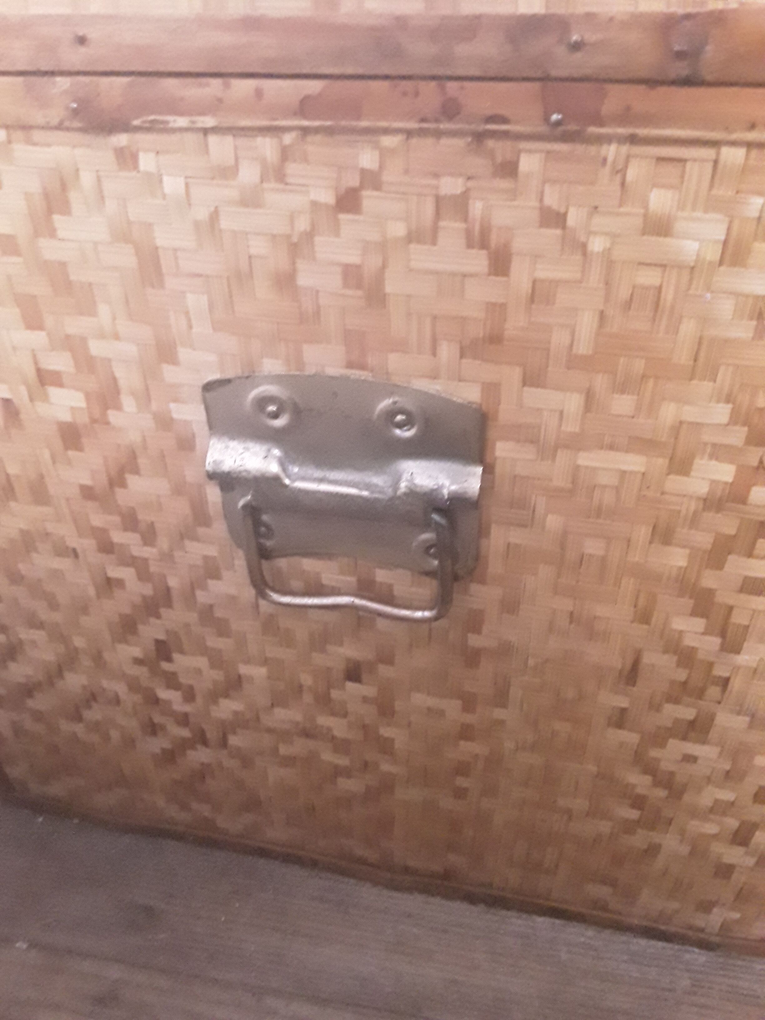 Wooden trunk with braiding