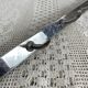 Stainless steel butcher's hook, known as a "wolf tooth bar."