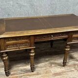 Renaissance style center desk with side pulls in carved walnut