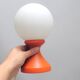 Small 1970s orange tulip-shaped ball lamp on a stand