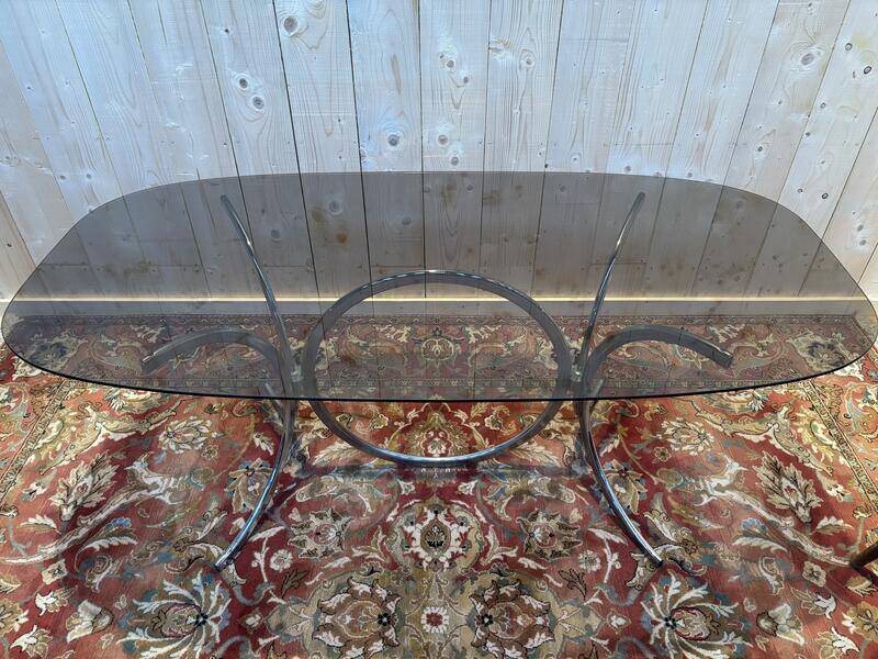 Contemporary glass and chrome dining table.